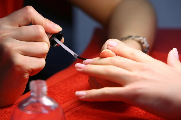 Closeup of hands doing manicure — Stock Photo, Image
