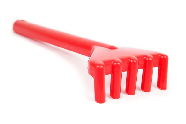 Rastrillo de juguete rojo para niños para el arenero aislado —  Fotos de Stock