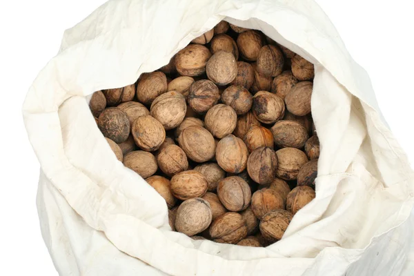 Орехи в белом мешке — стоковое фото