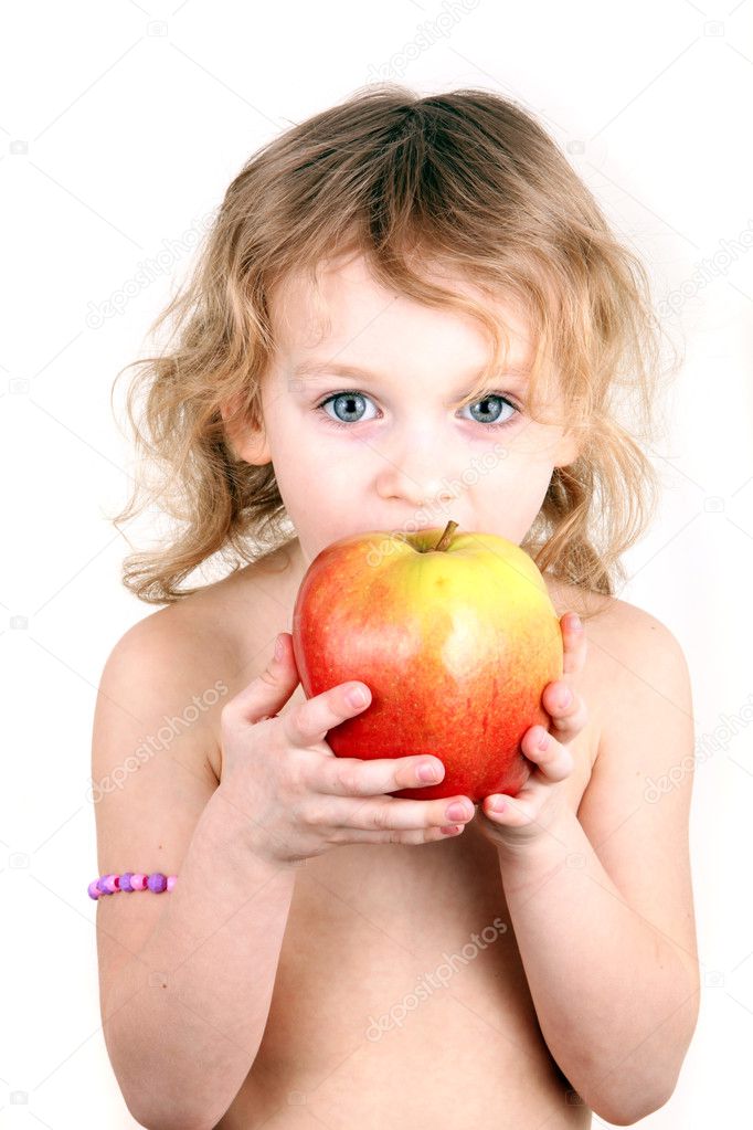 Little girl eating a big apple. Studio shot. Isolated over white