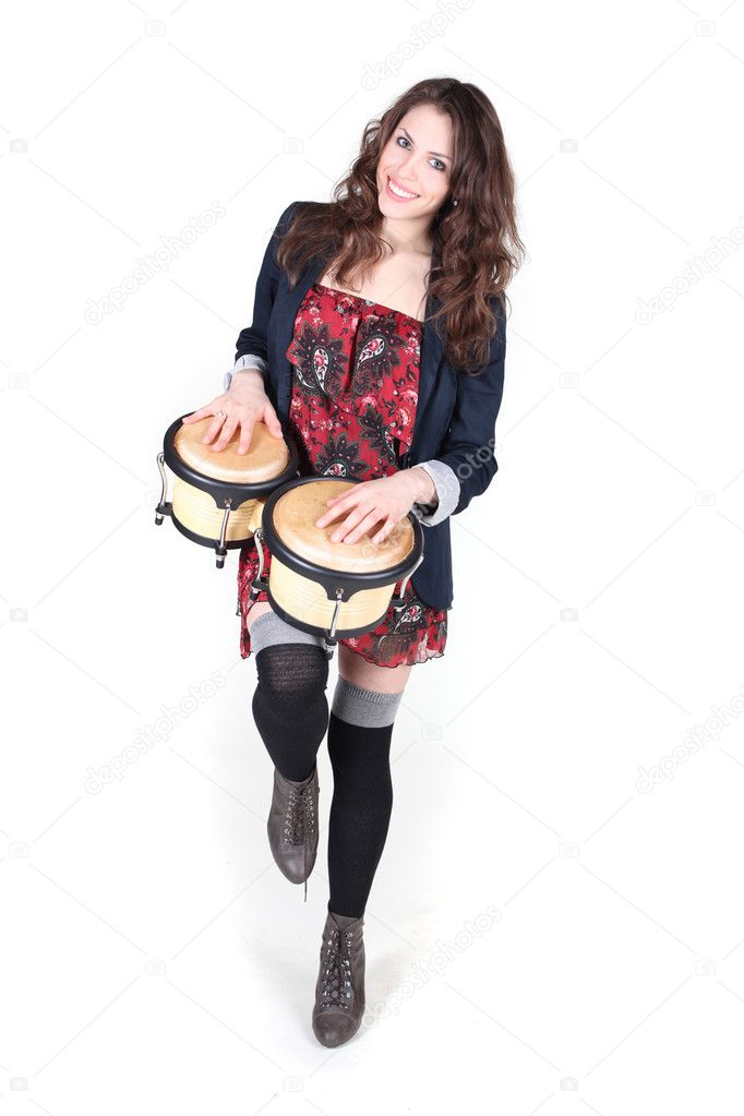 Girl playing percussion isolated on white background