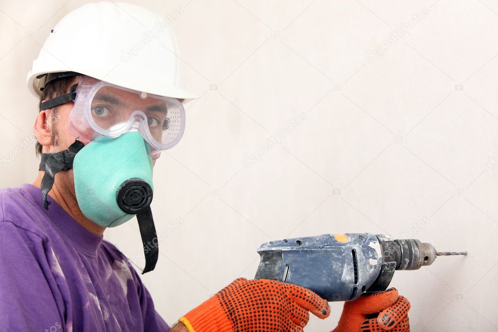 Worker holding drill