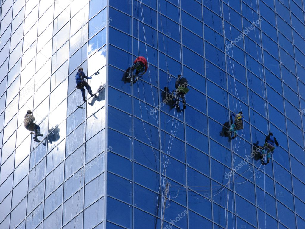 Six workers washing windows