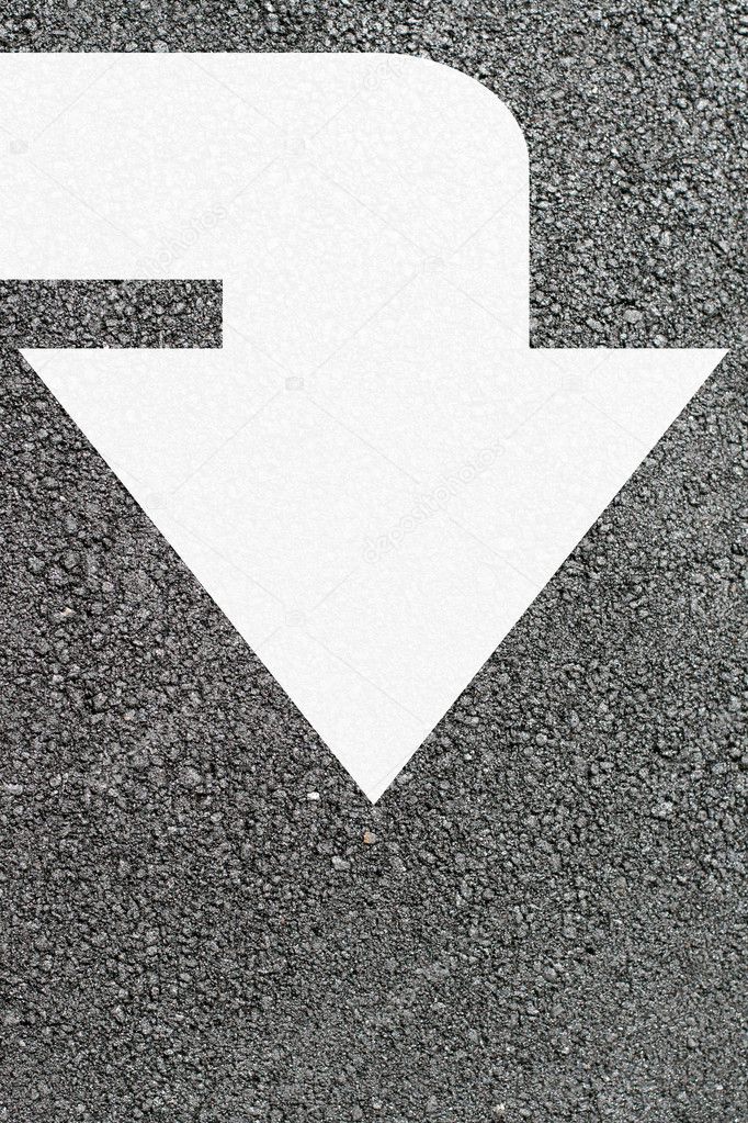 White arrow on new asphalt