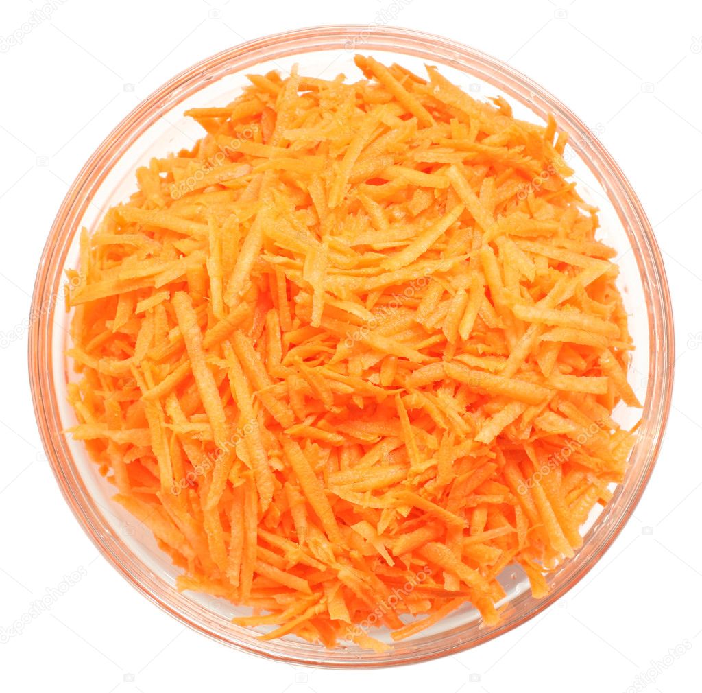 Uncooked carrot in a bowl on white background