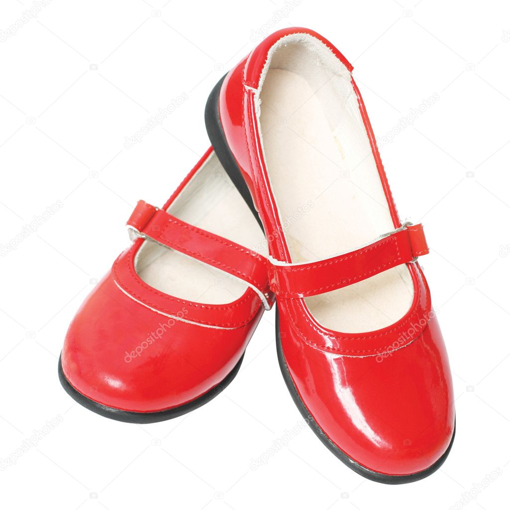 Red children's varnished shoes isolated on white background