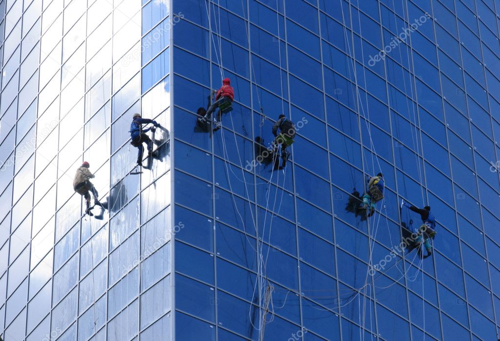 Six workers washing windows