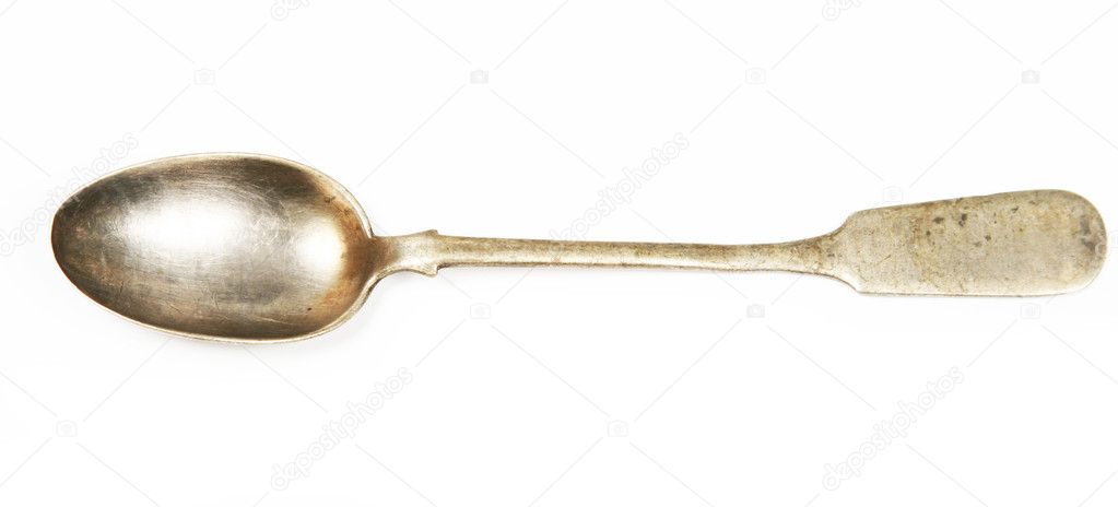 Vintage silver spoon on white background