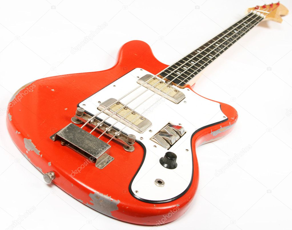 Vintage bass guitar isolated on white background