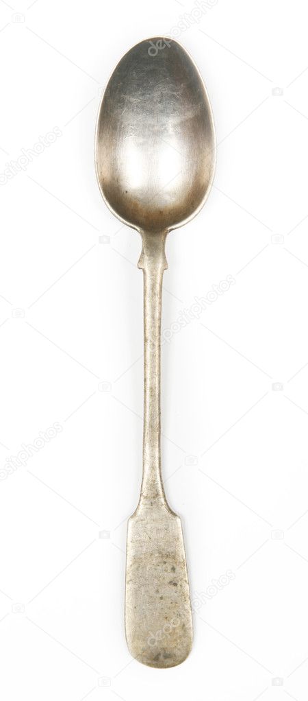 Old silver spoon on white background
