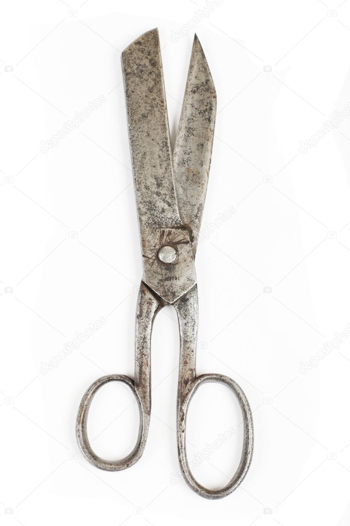 A pair of rusty scissors on white
