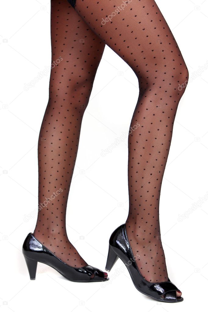 Woman legs wearing heel shoes and tights