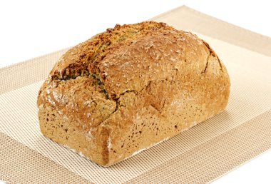 A loaf of bread on a textured tray clipart