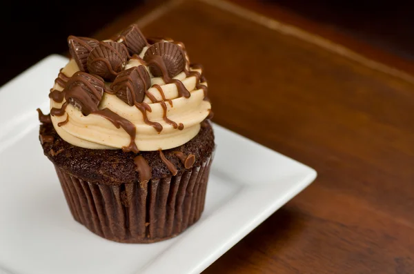 Peanut Butter Cupcake on Wood — Stock Photo, Image