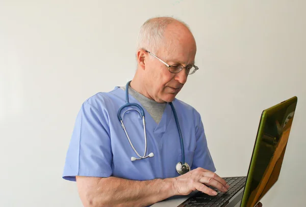 stock image Doctor holding laptop