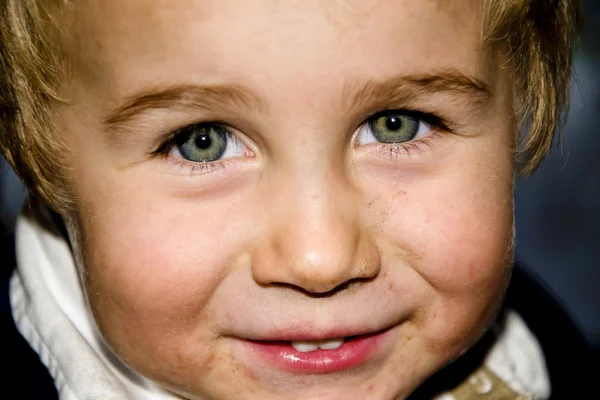 Little blond boy with a dirty face — Stock Photo, Image