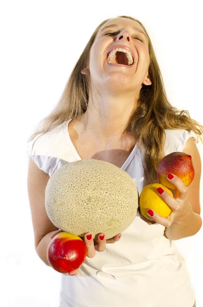 Girl laughs while holding fruits — Stock Photo, Image