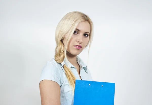 A beautiful girl with a folder indicates hand — Stock Photo, Image