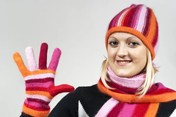 Beautiful girl in a hat and gloves, shows his hand — Stock Photo, Image