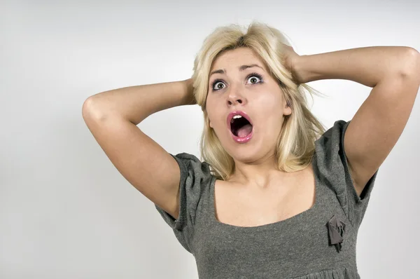 Beautiful girl in surprise shouts — Stock Photo, Image