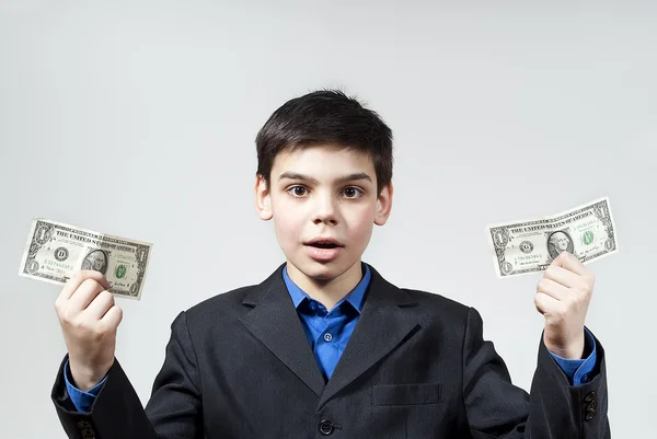 Chłopiec trzyma pieniądze — Zdjęcie stockowe