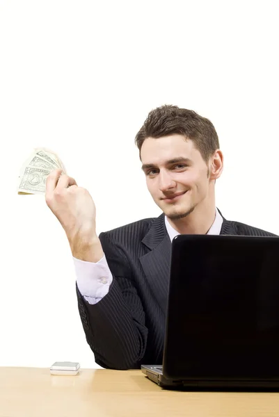 Pojke vid datorn och håller pengarna — Stockfoto