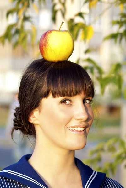 Brunette girl with apple — Stock Photo, Image