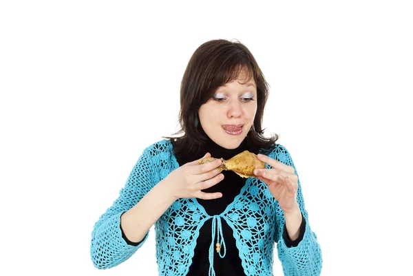 Ragazza mangia un pollo — Foto Stock