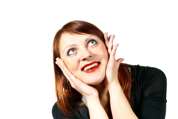 Redheaded girl looks up in surprise — Stock Photo, Image