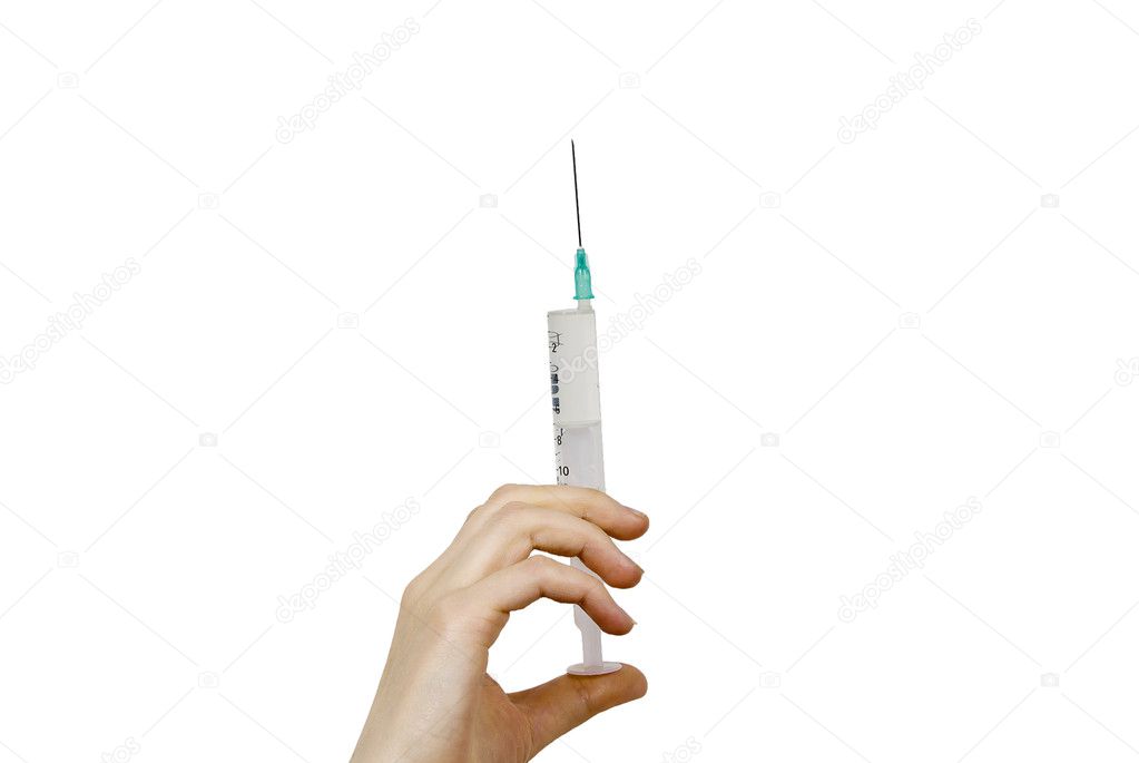 A syringe in his hand