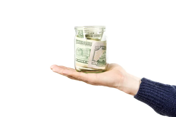 Χέρι κρατά γυάλινο βάζο με τα χρήματα — Φωτογραφία Αρχείου
