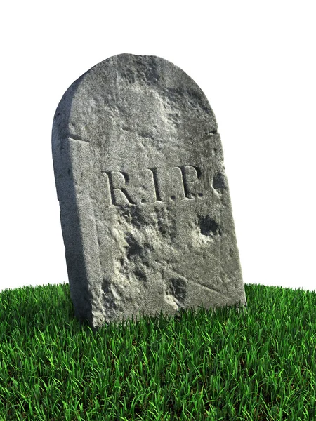 Могильный камень на траве — стоковое фото