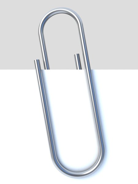 Close up of paper clip holding a blank paper sheet