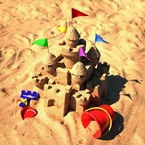 Castillo de arena con juguetes de playa —  Fotos de Stock