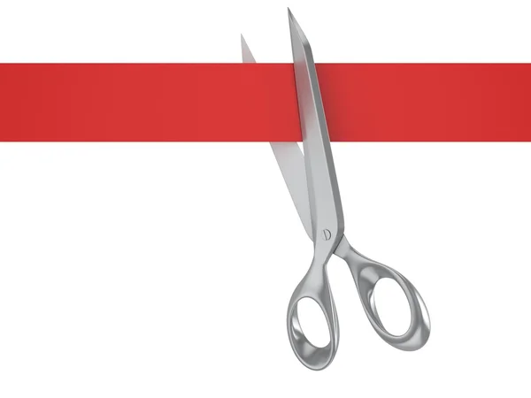 Nůžky stříhají červenou stuhu — Stock fotografie