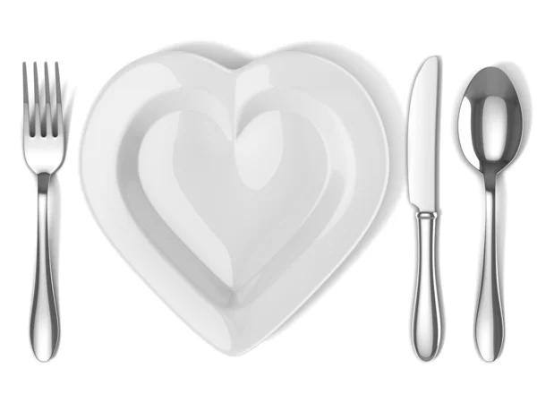 Heart shaped plate with silverware — Stock Photo, Image