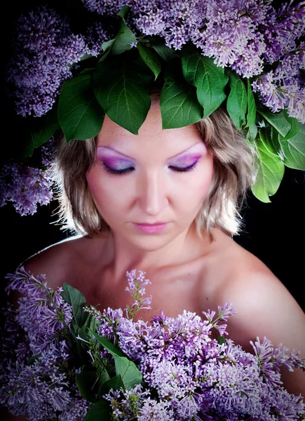 Girl with a sweet bouquet of lilacs — Stock Photo, Image
