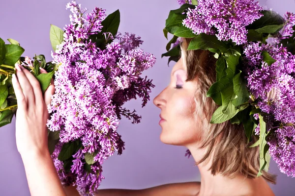 Girl with a sweet bouquet of lilacs — Stock Photo, Image