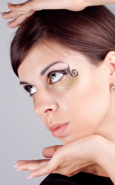 A girl with the golden visage — Stock Photo, Image