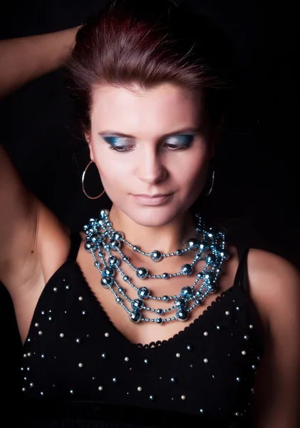 Girl with beads — Stock Photo, Image