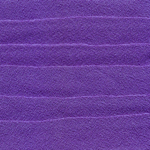 stock image Purple fabric cuttings background