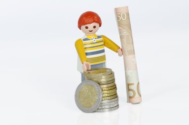 Playmobil figure with money clipart