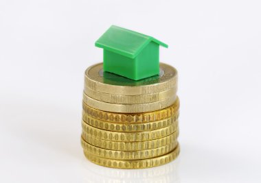 Coins and model house clipart