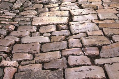 Medieval street paved with the cobble stones clipart