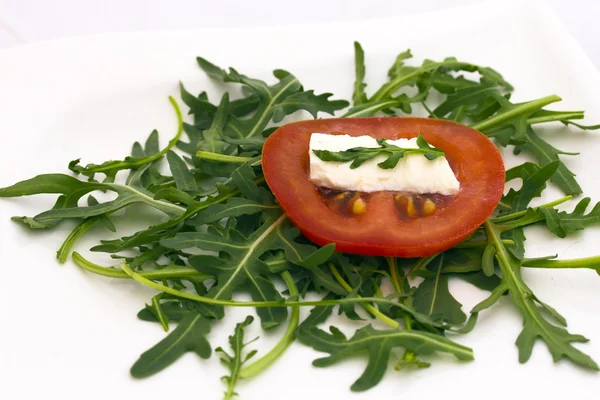 Tomato, cheese and rocket salad. — Stock Photo, Image