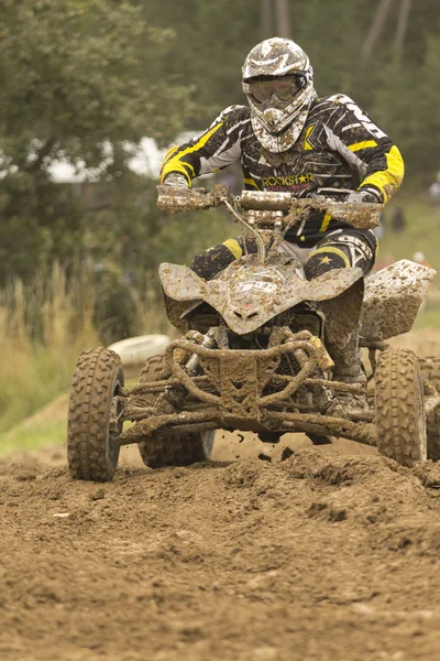 Quad motorbike rider in the mud — Stock Photo, Image