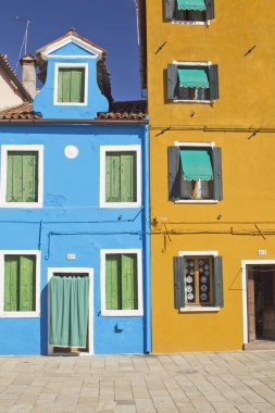 Blue and yellow house in Burano Island clipart