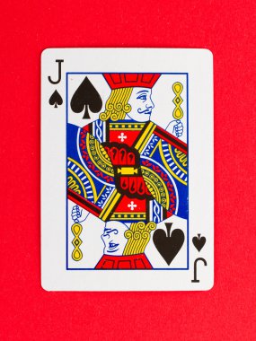 Old playing card (jack) isolated on a red background clipart