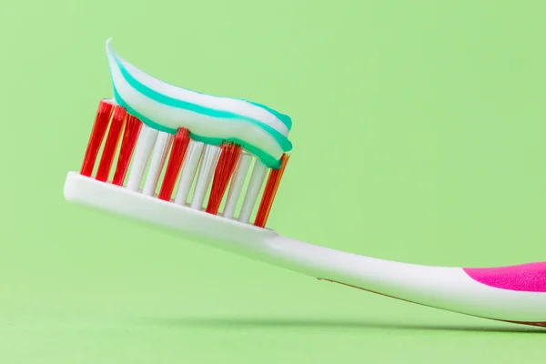 stock image A pink toothbrush with toothpaste