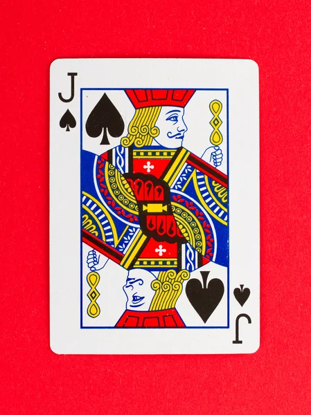 stock image Old playing card (jack) isolated on a red background